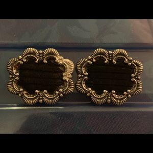 Silver and black shoe ornaments.